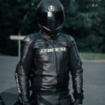 man in black leather jacket wearing black helmet