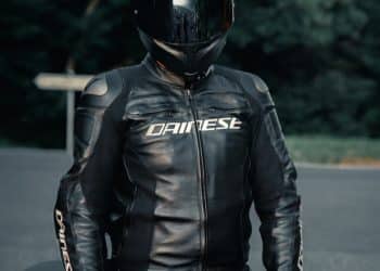 man in black leather jacket wearing black helmet