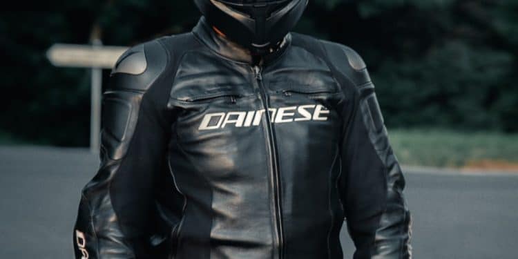 man in black leather jacket wearing black helmet